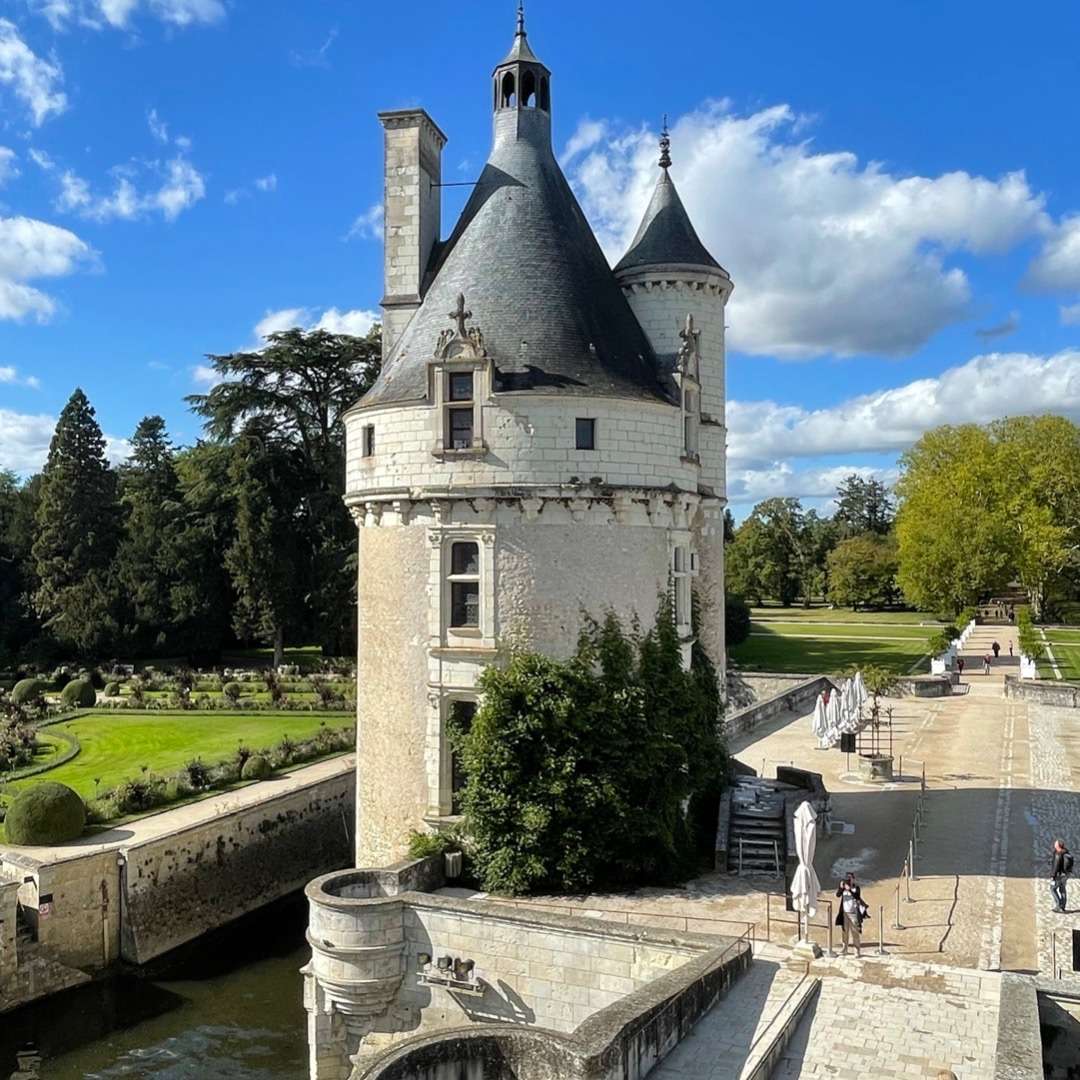 planning a trip to France Tower in front of formal gardens